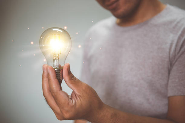istock Hand holding light bulb. idea with innovation and inspiration.  innovative technology and solution creative business design concept. 1334315788