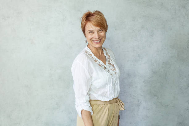 istock Successful smiling woman with toothy smile looking at camera 1334316347