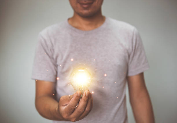istock Hand holding light bulb. idea with innovation and inspiration.  innovative technology and solution creative business design concept. 1334316872