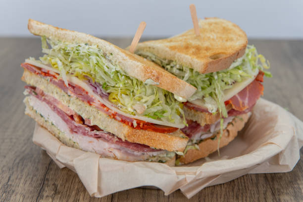 istock Sandwich or salad served on a wooden table. 1334317084