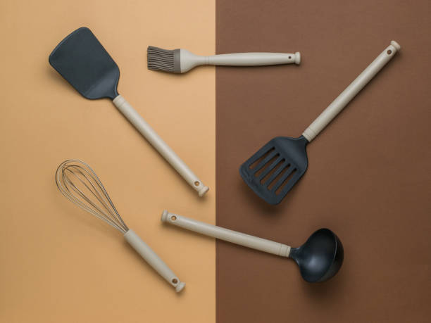 istock A set of kitchen accessories on a two-color background. Flat lay. 1334317116