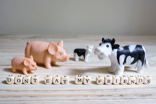 "Don't eat my friends" inscription and toy pigs and cows cattle animals "Don't eat my friends" inscription and toy pigs and cows cattle animals. Vegan, vegetarianism, animal welfare, conscious consumption concept dont eat meat stock pictures, royalty-free photos & images