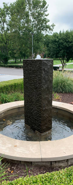 istock Bird visits Serene Bubbling Water Fountain 1334321478