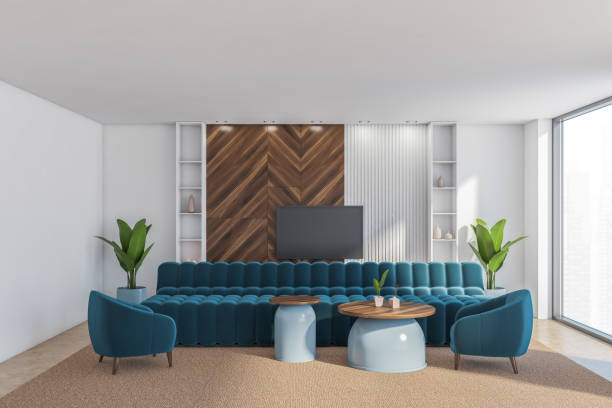 istock Front view of the living room with television, bright blue sofa 1334322632