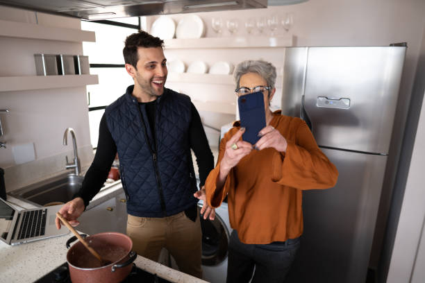 istock Mother and son doing a video call on smartphone at home 1334322717