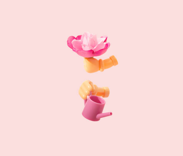 istock Illogical concept of water can and flower. 1334323029