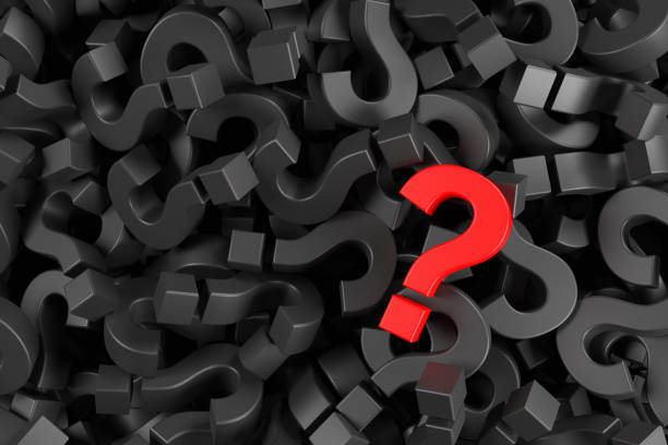 istock Red question mark on a background of black marks. 1334324498