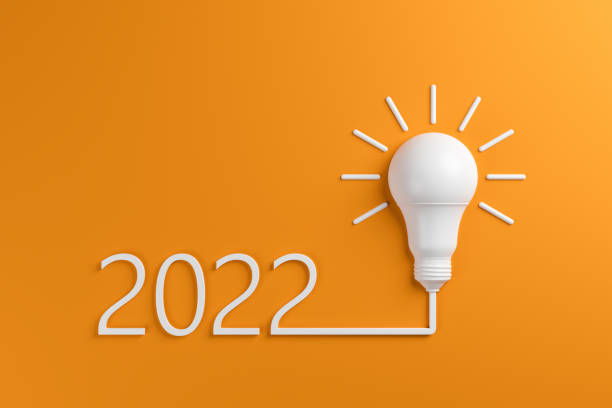 istock Set of New Year 2022 and light bulb on orange background. 1334324507