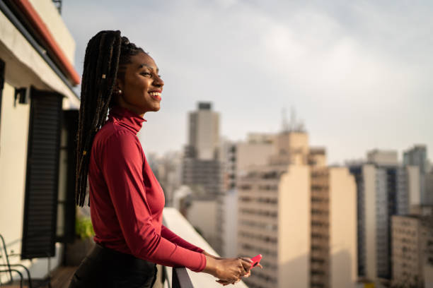 istock Young woman looking away contemplating in a rooftop 1334325152