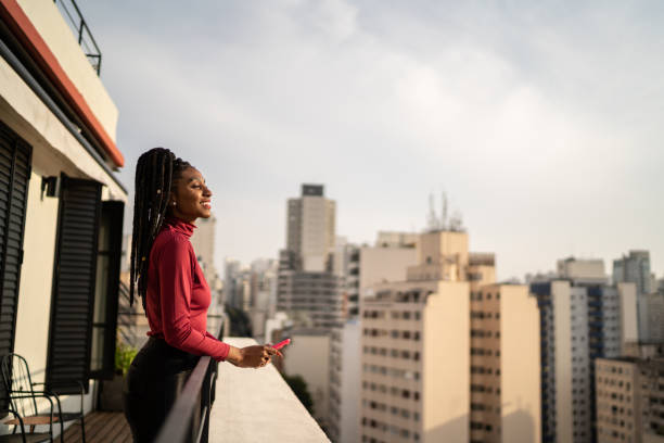 istock Young woman looking away contemplating in a rooftop 1334325272