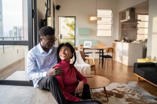 istock Happy couple looking at each other at home 1334325489