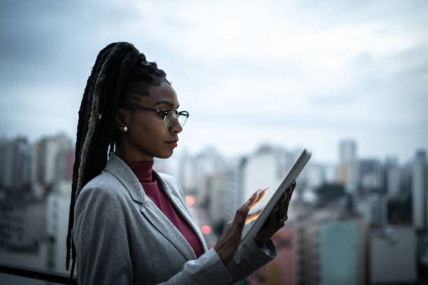 istock Businesswoman using digital tablet in a rooftop 1334325624