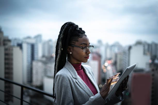 istock Businesswoman using digital tablet in a rooftop 1334325627