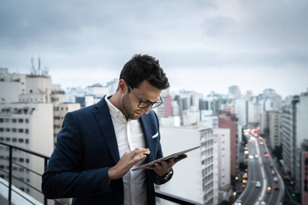 istock Focused businessman using digital tablet in a rooftop 1334325642