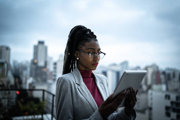 istock Businesswoman using digital tablet in a rooftop 1334325651