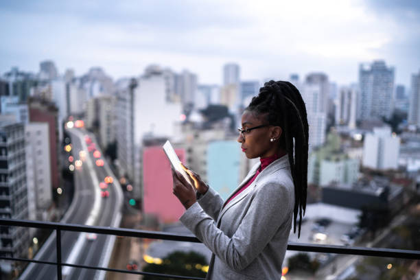 istock Businesswoman using digital tablet in a rooftop 1334325677