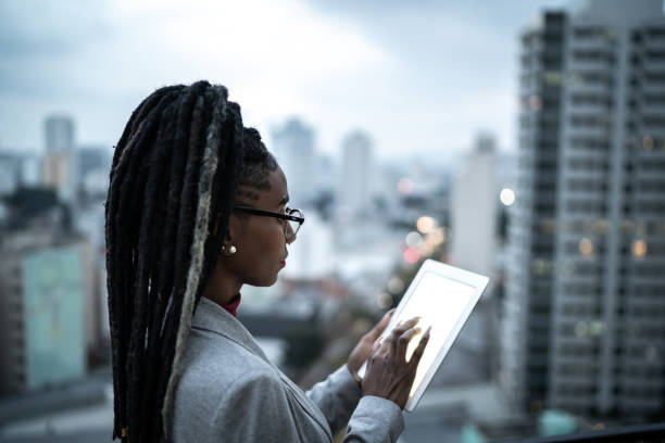 istock Businesswoman using digital tablet in a rooftop 1334325702
