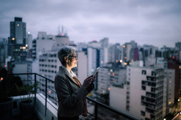 istock Senior businesswoman contemplating and using digital tablet in a rooftop 1334326828