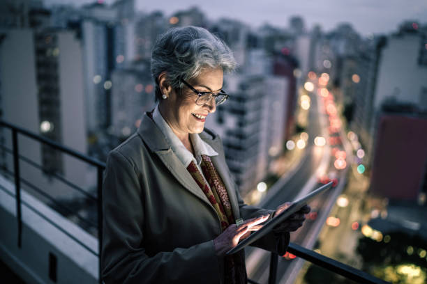 istock Senior businesswoman using digital tablet in a rooftop 1334326836