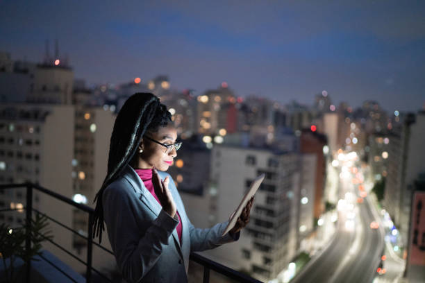 istock Businesswoman doing a video call on digital tablet in a rooftop 1334326956