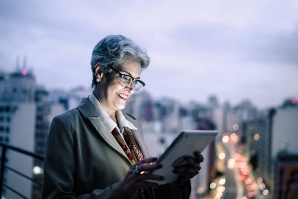 istock Senior businesswoman using digital tablet in a rooftop 1334326968
