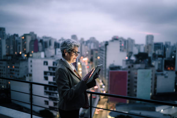 Senior businesswoman using digital tablet in a rooftop
