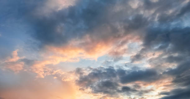 istock Sunset or sunrise, sky nature background with multicolored clouds 1334330484