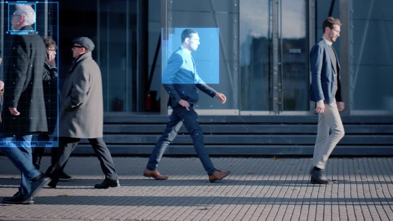 Crowd of Business People Tracked with Technology Walking on Busy Urban City Streets. CCTV AI Facial Recognition Big Data Analysis Interface Scanning, Showing Animated Information.