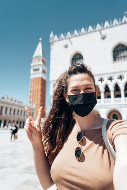 istock tourist in venice wearing a face mask 1334336787