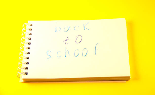 istock school, notepad with the inscription back to school 1334337053