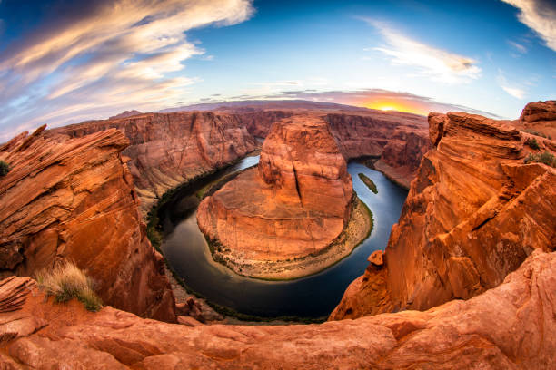 Sunset over Horseshoe Bend An evening sunset shot of Horseshoe Bend -- a horseshoe shaped canyon high above the Colorado River near Lake Powell and the Grand Canyon. lake powell stock pictures, royalty-free photos & images