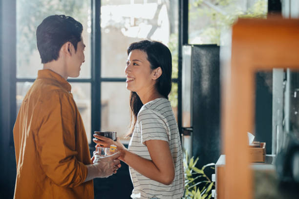istock Smiling Boyfriend and Girlfriend Enjoying Having Breakfast Together at Home 1334337786