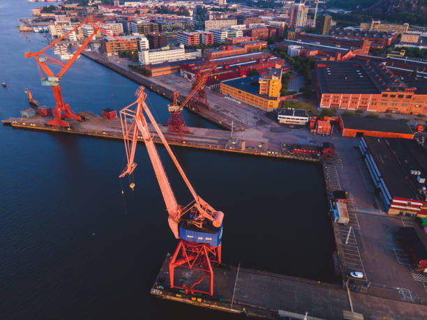 Cranes at sunrise seen in Gothenburg, Sweden stock photo