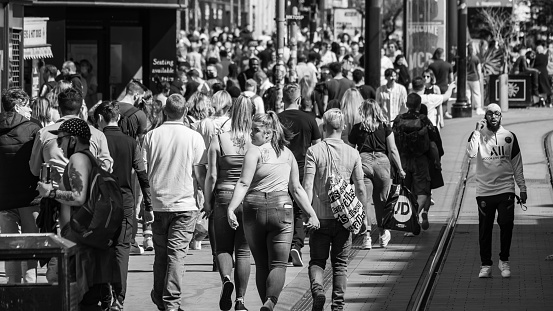 Manchester, United Kingdom - 30 May, 2021 : City centre of Manchester. People walk in Manchester district.