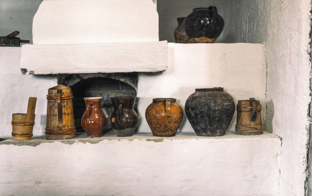 istock Clay jugs and pots. Vintage traditional rustic tableware on the oven shelf 1334338706