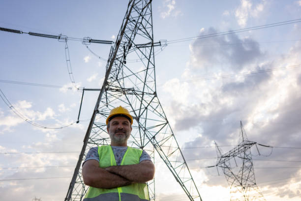 istock Engineers standing in front of power plant by sunset. 1334339022