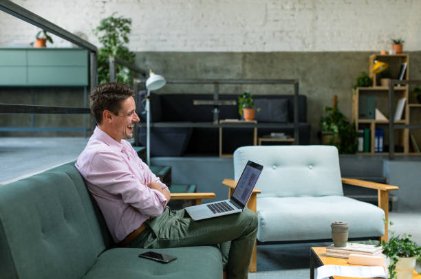 istock Happy Businessman Laughing at Work 1334341116