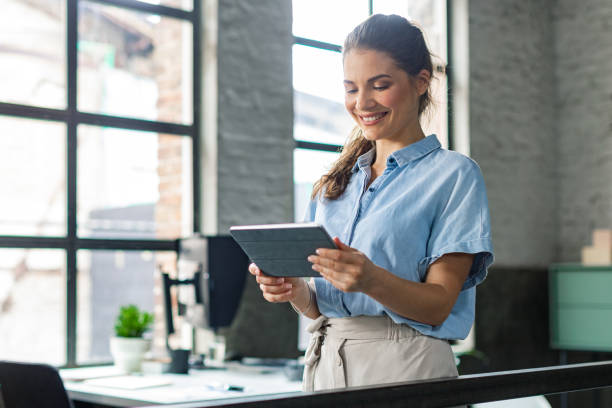 istock Beautiful Businesswoman Using Tablet 1334341119