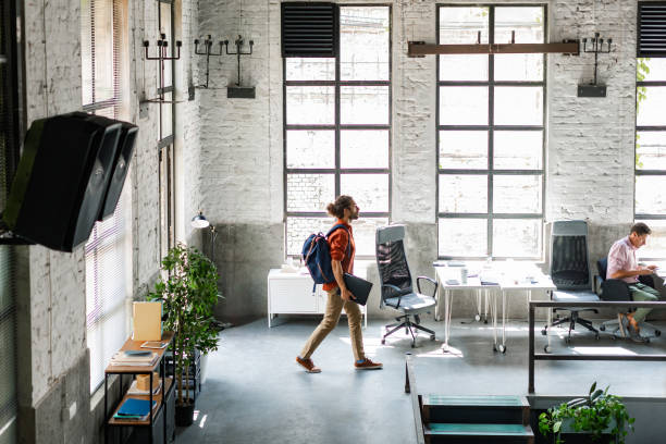 istock Stimulating Work Environment: Happy Young Businessman Arriving at Work in the Morning 1334341133