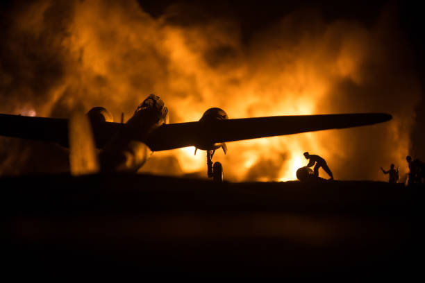 istock German Junker (Ju-88) night bomber at night. Artwork decoration with scale model of jet-propelled plane in possession. Toned foggy background with light. War scene. 1334342130