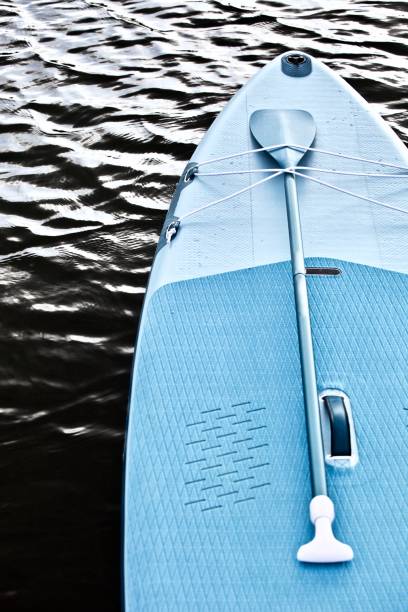 Woman paddling on a stand-up paddleboard\nNotice to review: The date was not set correctly on the camera
