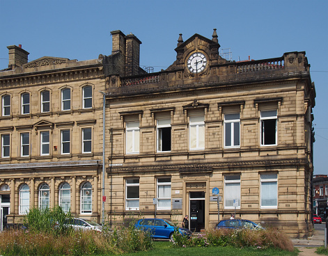 brighouse, west yorkshire, united kingdom - 21 july 2021: old buildings on thornton square in brighouse west yorkshire with the old former town hall