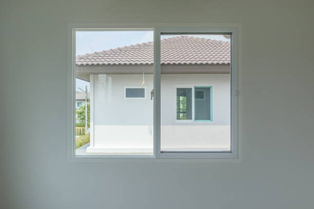 istock Glass window frame house interior on white wall 1334359284