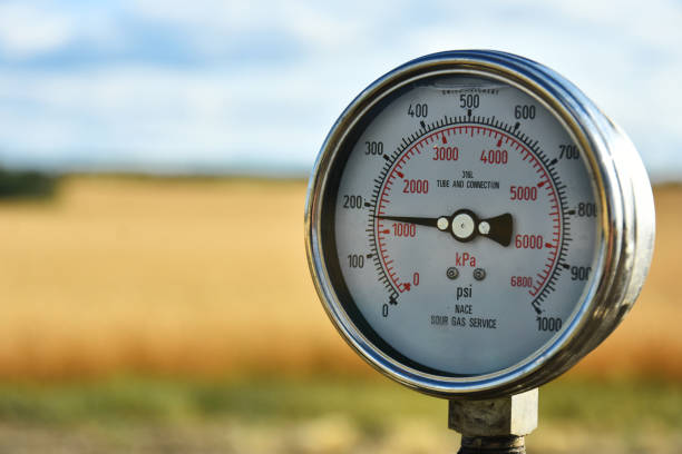 Industrial Pressure Gauges A close up image of an industrial pressure gauge used in the oil and gas industry. pressure gauge stock pictures, royalty-free photos & images