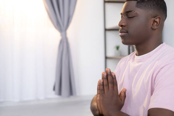 istock morning relax peaceful black man home practice 1334359655