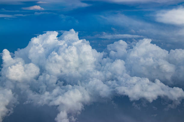 istock Aerial shot of high angle clouds from airplane 1334365952