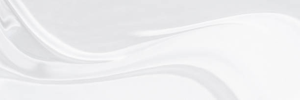 istock White gray satin texture that is white silver fabric silk background with beautiful soft blur pattern natural. 1334365967
