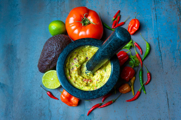 istock guacamole bowl on textured background with vegetables 1334371022