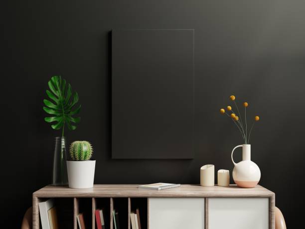 istock Mockup black poster on cabinet in living room interior on empty dark wall. 1334372845