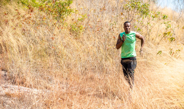 istock African man trail running on the mountain in summer day 1334377456